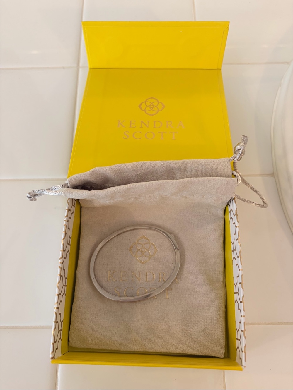 Kendra Scott Silver Bangle Bracelet with Yellow Branded Box
